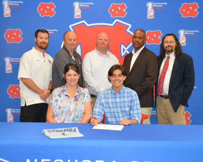 Neshoba Central’s Jaxon Dunaway signed with Itawamba Community College to further his education and be a member of the band. Pictured, front row from left, are his mother Nicole Benson and Jaxon Dunaway (Back) Assistant Principal Jonathan Walker, Principal Jason Gentry, Assistant Principal Brent Pouncy Assistant Principal LaShon Horne, and Band Director Daniel Wade.